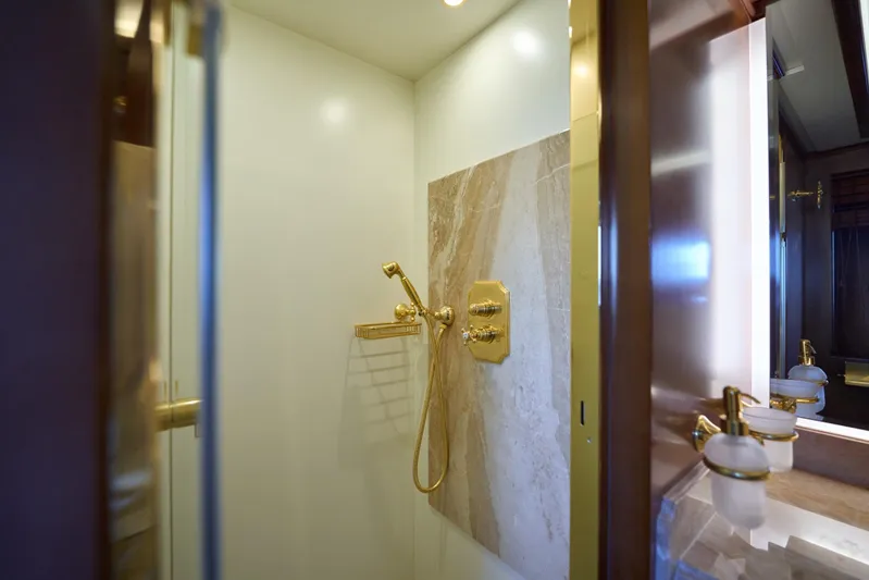 Sea Bear Yacht Photos Pics Luxurious bathroom with gold fixtures on 2013 Benetti 93 Delfino yacht.