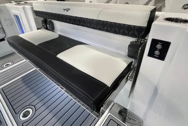  Yacht Photos Pics 2025 Tidewater 380 CC Adventure boat with sleek black and white seating.