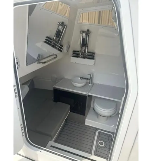  Yacht Photos Pics 2025 Tidewater 380 CC Adventure boat interior with modern bathroom amenities.