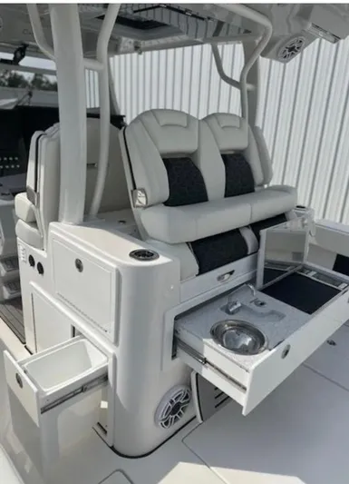  Yacht Photos Pics 2025 Tidewater 380 CC Adventure boat interior with seating and storage compartments.