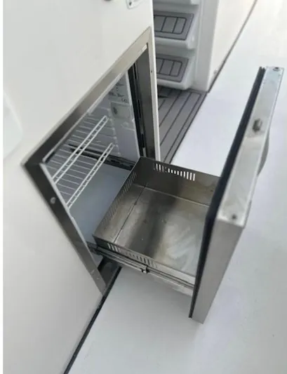  Yacht Photos Pics Stainless steel drawer on 2025 Tidewater 380 CC Adventure boat, open to reveal storage space.