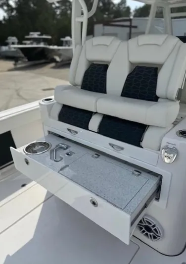  Yacht Photos Pics 2025 Tidewater 380 CC Adventure boat with luxurious seating and integrated storage.