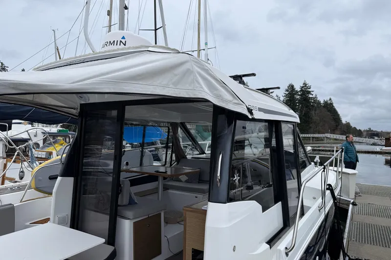  Yacht Photos Pics 2020 Jeanneau NC 895 docked, showcasing sleek design and spacious interior.