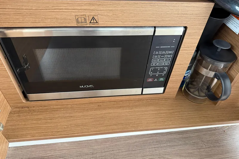  Yacht Photos Pics Microwave and French press in Jeanneau NC 895 boat kitchen, 2020 model.