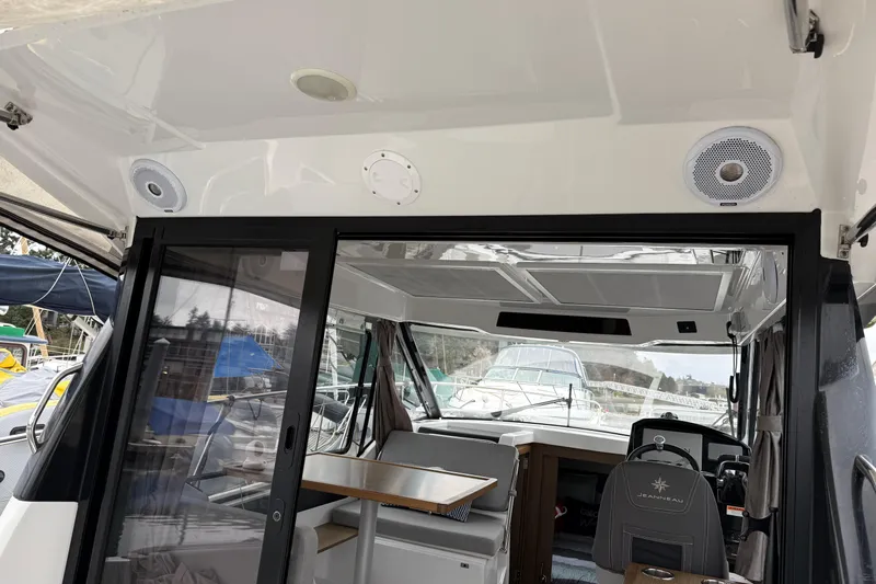  Yacht Photos Pics Interior view of 2020 Jeanneau NC 895 boat with sliding glass door.