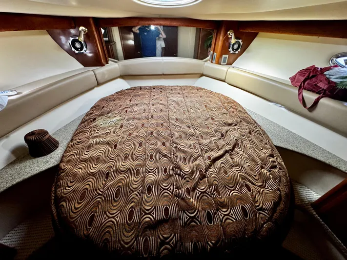  Yacht Photos Pics Luxurious cabin interior of 2007 Meridian 411 Sedan yacht with patterned bedding.