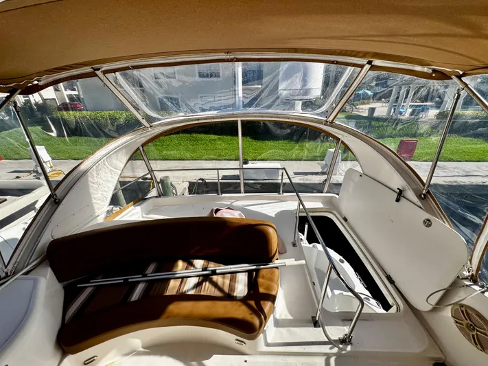  Yacht Photos Pics 2007 Meridian 411 Sedan yacht interior with brown seating and open hatch.