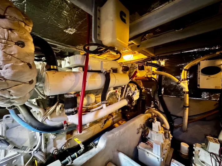  Yacht Photos Pics Engine room of a 2007 Meridian 411 Sedan yacht, showcasing mechanical components and wiring.