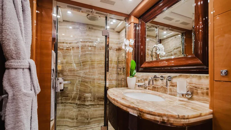 Groover Yacht Photos Pics Luxurious bathroom in 2009 Benetti 145 yacht with marble sink and glass shower.