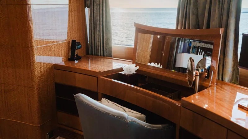 Groover Yacht Photos Pics Luxurious interior of 2009 Benetti 145 yacht with elegant wooden desk and ocean view.