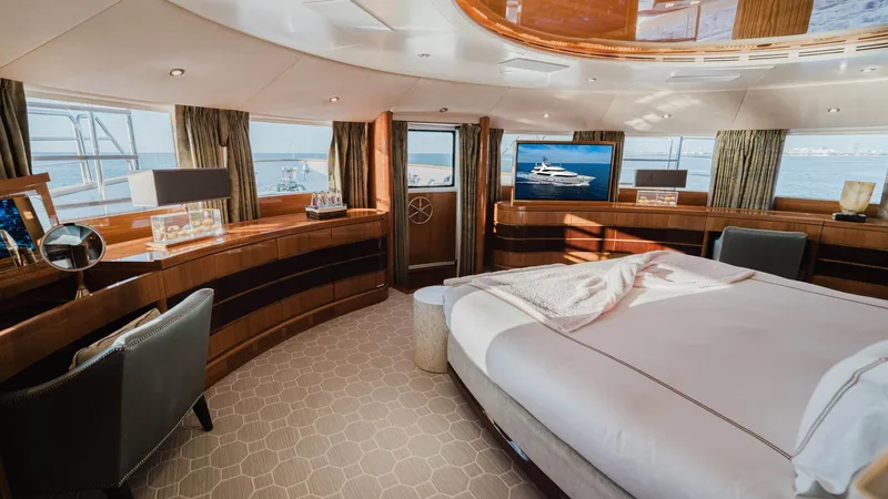 Groover Yacht Photos Pics Luxurious interior of 2009 Benetti 145 yacht with elegant bedroom and panoramic windows.