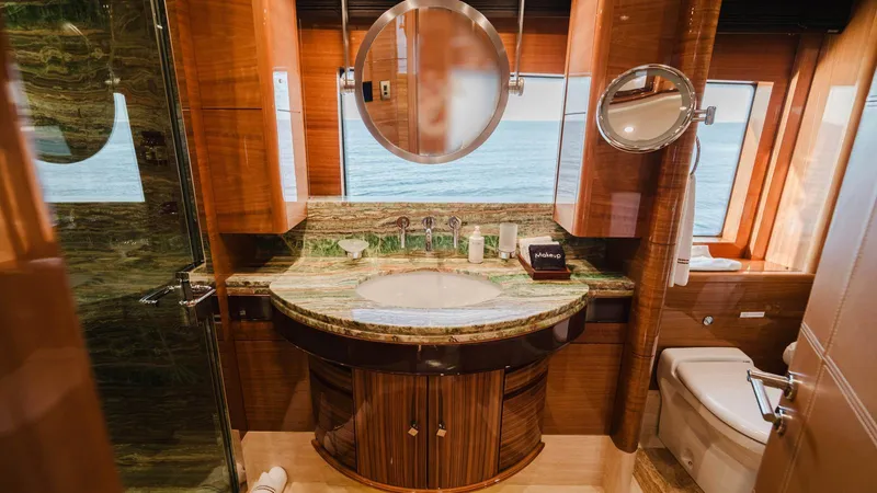 Groover Yacht Photos Pics Luxurious bathroom on 2009 Benetti 145 yacht with elegant wood and marble finishes.