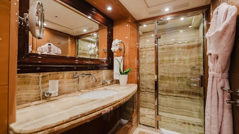 Groover Yacht Photos Pics Luxurious bathroom on 2009 Benetti 145 yacht with marble sink and glass shower.