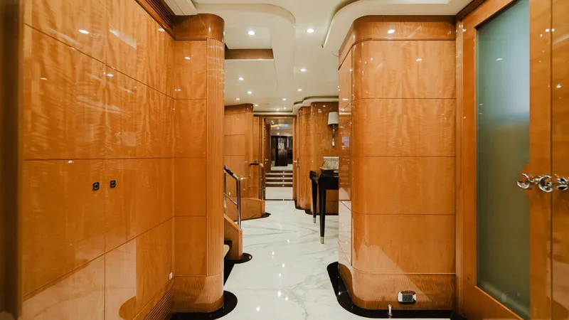 Groover Yacht Photos Pics Luxurious interior of 2009 Benetti 145 yacht with polished wood and marble flooring.