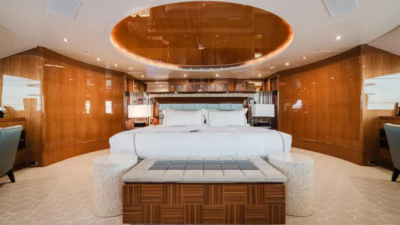 Groover Yacht Photos Pics Luxurious bedroom interior of 2009 Benetti 145 yacht with elegant wood paneling and modern furnishings.
