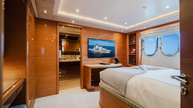Groover Yacht Photos Pics Luxurious bedroom interior of 2009 Benetti 145 yacht with elegant wood paneling and ocean view.