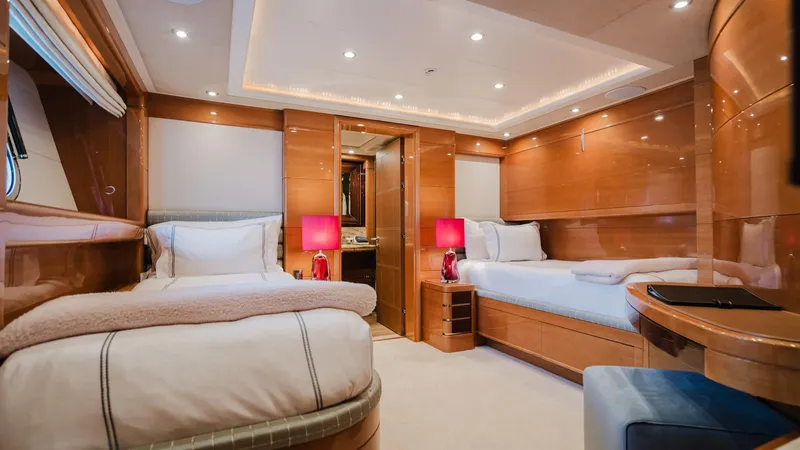 Groover Yacht Photos Pics Luxurious cabin interior of 2009 Benetti 145 yacht with twin beds and elegant wood finish.