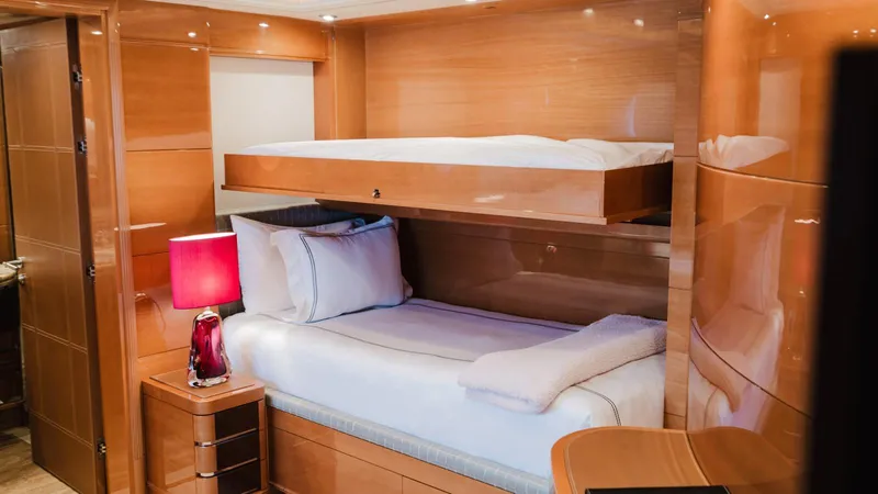 Groover Yacht Photos Pics Luxurious cabin interior of 2009 Benetti 145 yacht with bunk beds and elegant wood finish.