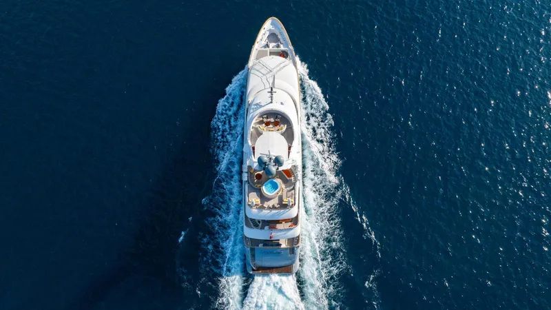 Groover Yacht Photos Pics Aerial view of 2009 Benetti 145 yacht cruising on open sea.
