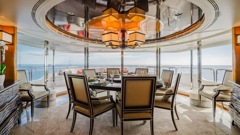 Groover Yacht Photos Pics Luxurious dining area on 2009 Benetti 145 yacht with ocean view.