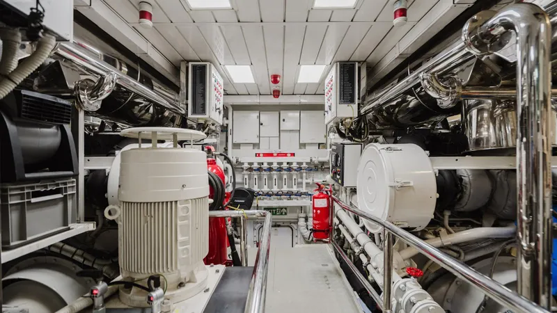 Groover Yacht Photos Pics Engine room of 2009 Benetti 145 yacht, featuring advanced machinery and equipment.