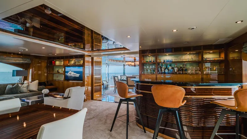 Groover Yacht Photos Pics Luxurious interior of 2009 Benetti 145 yacht with elegant bar and seating area.