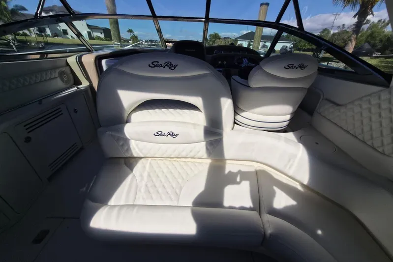  Yacht Photos Pics Interior of a 2004 Sea Ray 380 Sundancer boat with white seating.