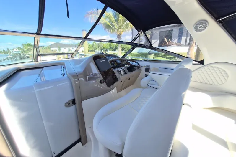 Yacht Photos Pics 2004 Sea Ray 380 Sundancer helm with luxurious seating and modern controls.