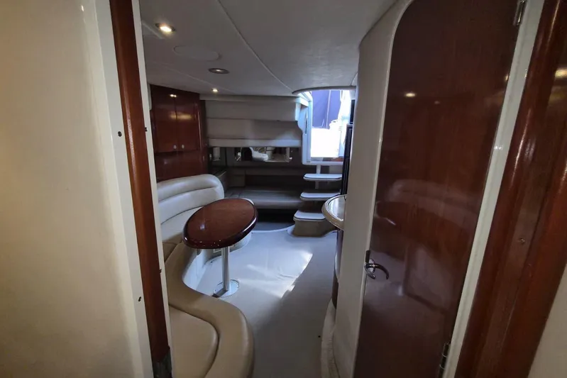  Yacht Photos Pics Interior of 2004 Sea Ray 380 Sundancer yacht with elegant seating and wooden finishes.