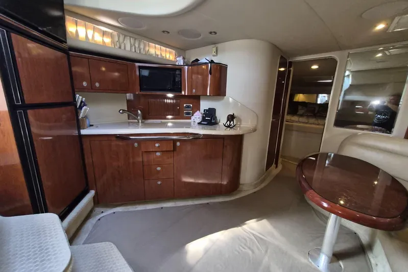  Yacht Photos Pics Luxurious 2004 Sea Ray 380 Sundancer yacht interior with modern kitchen and dining area.