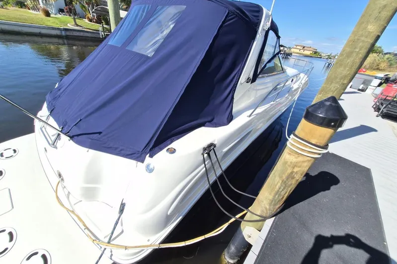  Yacht Photos Pics 2004 Sea Ray 380 Sundancer docked with blue cover, sunny day.