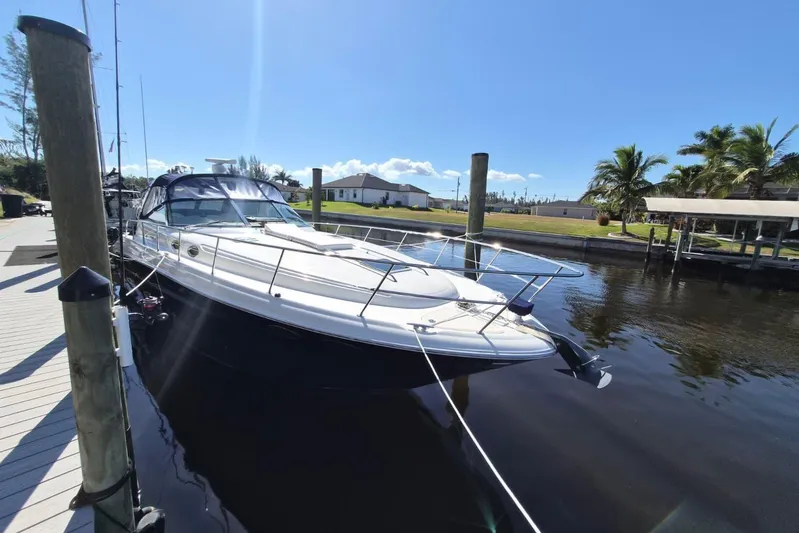  Yacht Photos Pics 2004 Sea Ray 380 Sundancer yacht docked on a sunny day.