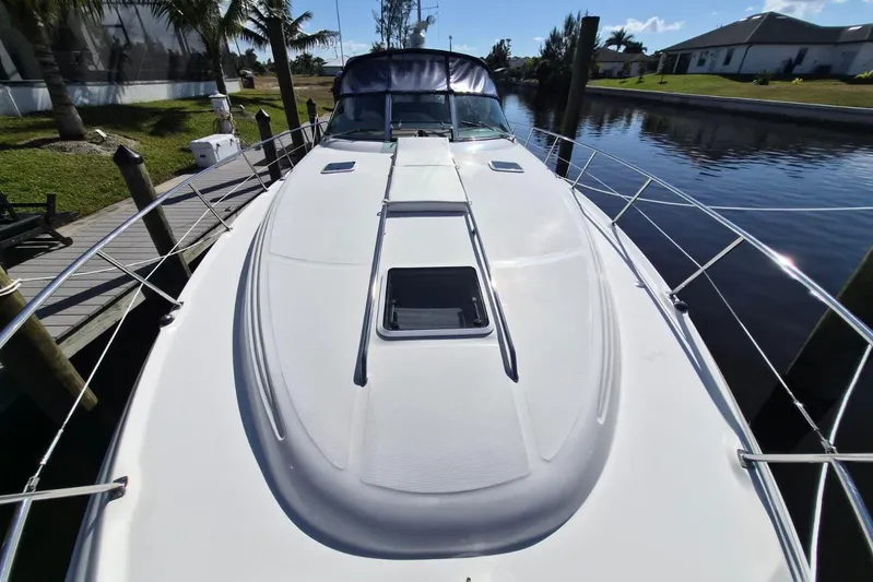  Yacht Photos Pics 2004 Sea Ray 380 Sundancer yacht docked on a sunny day.