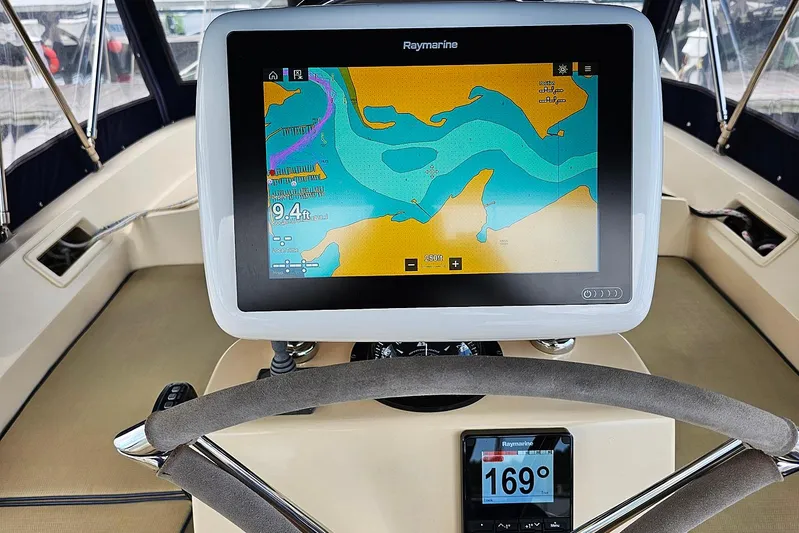  Yacht Photos Pics Navigation system on 2006 Island Packet 445 sailboat, featuring Raymarine display and steering wheel.