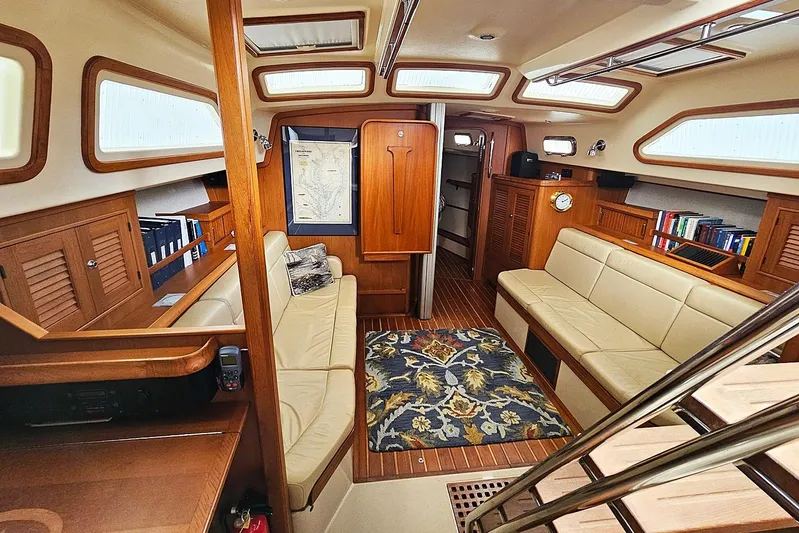  Yacht Photos Pics Luxurious interior of 2006 Island Packet 445 yacht with wood finishes and comfortable seating.