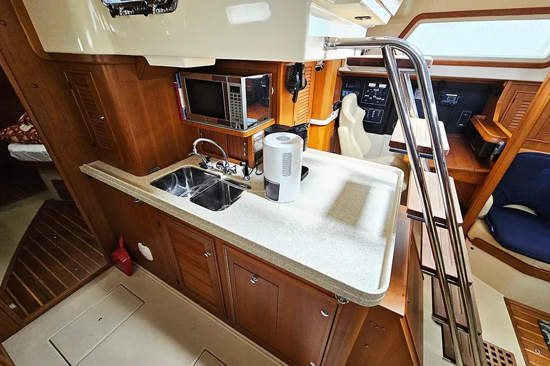  Yacht Photos Pics 2006 Island Packet 445 yacht interior with kitchen, sink, and microwave.