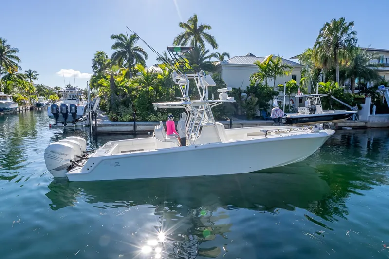  Yacht Photos Pics 2019 SeaVee 340Z boat cruising in a tropical canal with palm trees.