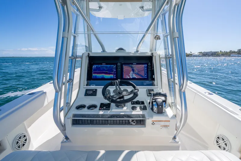  Yacht Photos Pics 2019 SeaVee 340Z boat helm with navigation screens on open water.