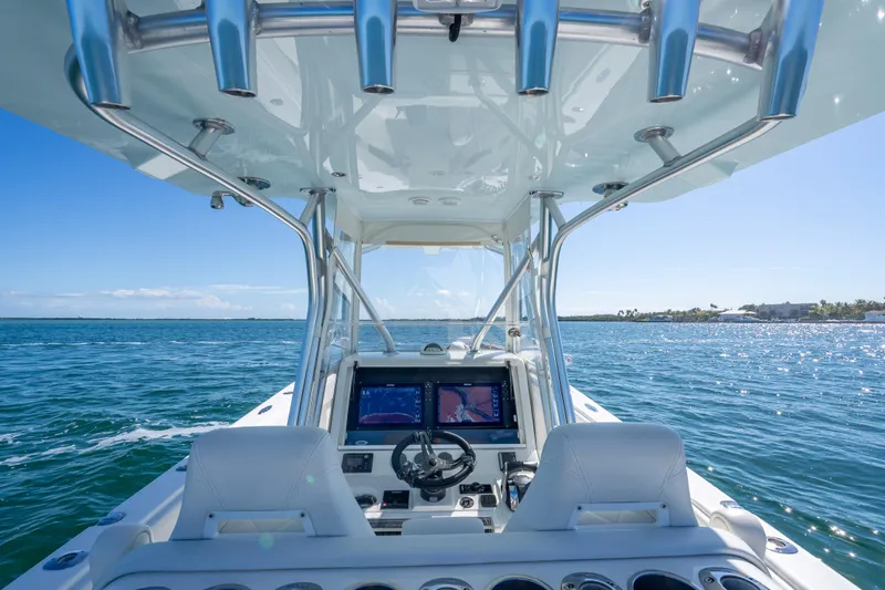  Yacht Photos Pics 2019 SeaVee 340Z boat interior with navigation screens, steering wheel, and ocean view.
