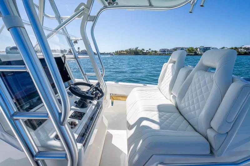  Yacht Photos Pics 2019 SeaVee 340Z boat interior with luxurious seating and modern controls on a sunny day.