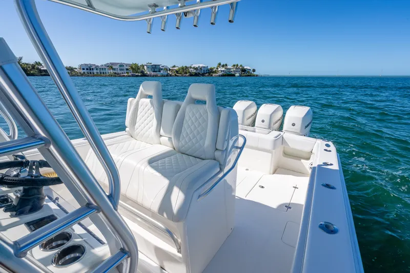  Yacht Photos Pics 2019 SeaVee 340Z boat with luxurious seating and multiple engines on open water.