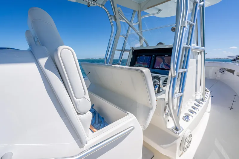  Yacht Photos Pics 2019 SeaVee 340Z boat interior with helm station and seating, under clear blue sky.