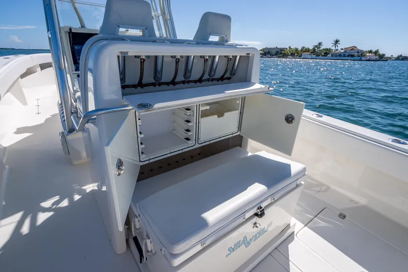  Yacht Photos Pics 2019 SeaVee 340Z boat with open storage compartments, on a sunny day by the water.