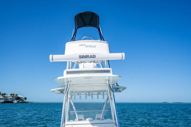  Yacht Photos Pics 2019 SeaVee 340Z boat with Simrad equipment on open water under clear blue sky.