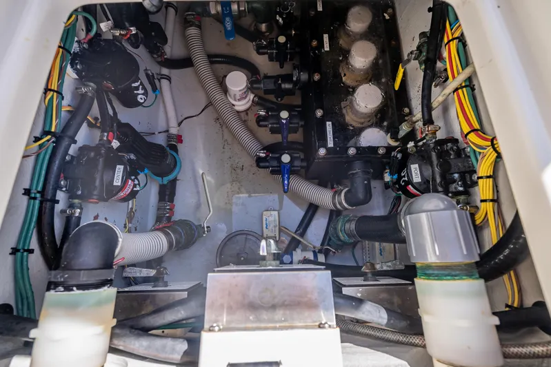  Yacht Photos Pics Engine compartment of a 2019 SeaVee 340Z boat, showcasing intricate wiring and plumbing.