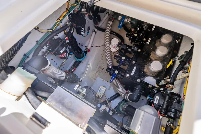  Yacht Photos Pics Engine compartment of a 2019 SeaVee 340Z boat, showcasing mechanical components and wiring.