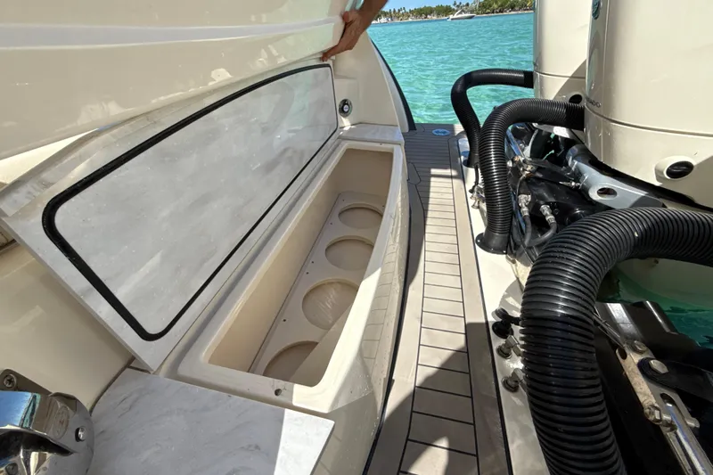  Yacht Photos Pics 2021 Scout 420 LXF boat storage compartment and engine detail.