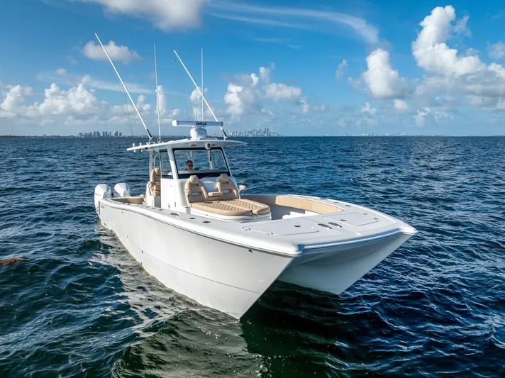  Yacht Photos Pics 2025 Freeman 35 boat cruising on open ocean under clear blue sky.