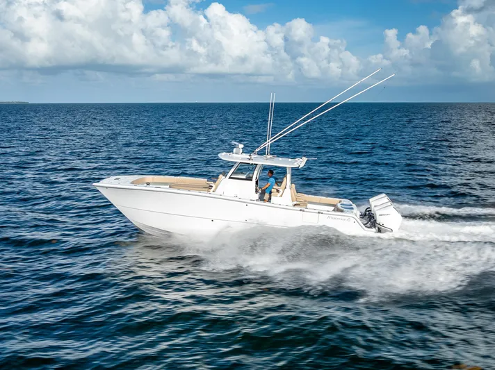  Yacht Photos Pics 2025 Freeman 35 boat cruising on open ocean under clear blue sky.