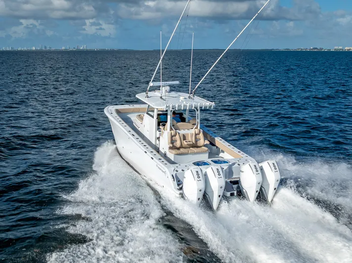  Yacht Photos Pics 2025 Freeman 35 boat cruising on open water with four powerful engines.